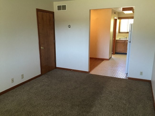 Bedroom with wooden floor at Dutch Hills Terrace Apartments, Parkersburg, WV, 26104