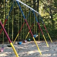 a swing set in the middle of a park