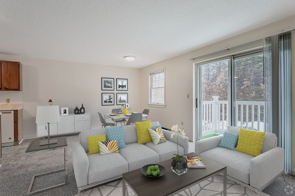 A living room with a grey couch and a coffee table.