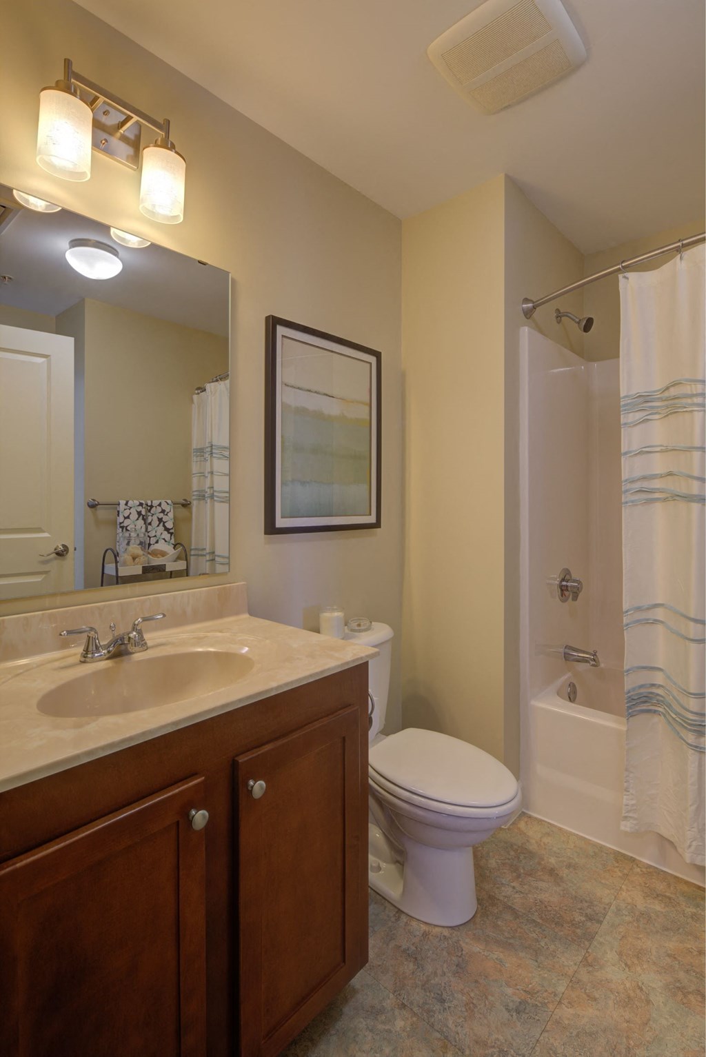 a bathroom with a sink toilet and a shower
