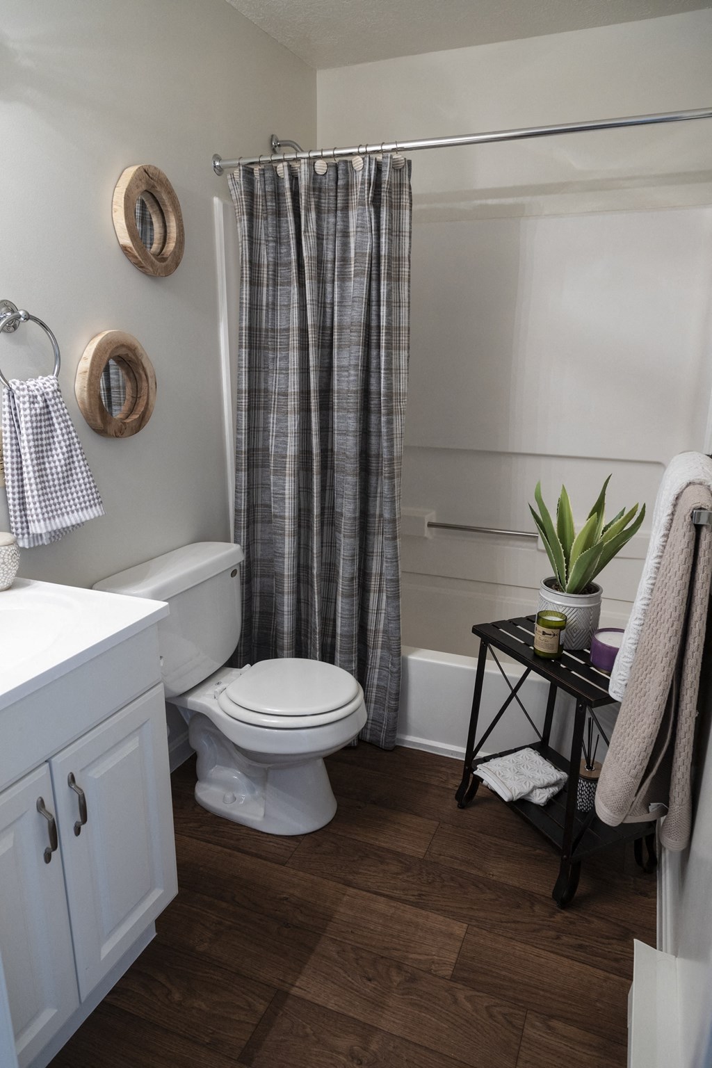 a small bathroom with a toilet and a shower curtain