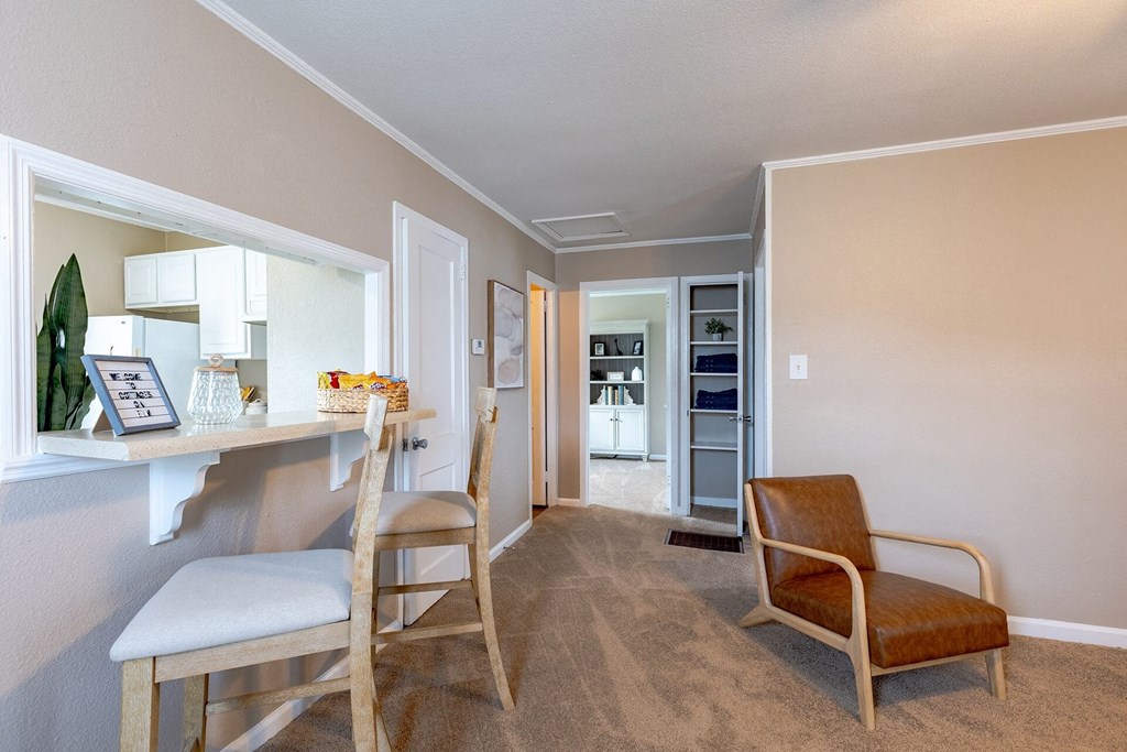 A living room with a chair and a table.