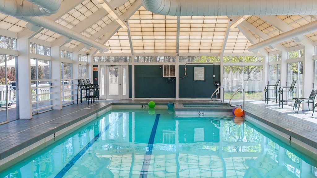 a swimming pool in a building with a pool