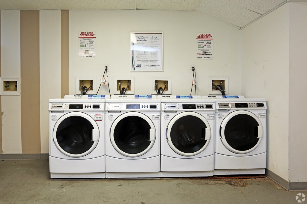 a row of washing machines in a public laundromat
