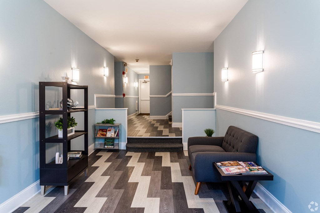 Lincoln Court Apartments lobby with a couch and a table