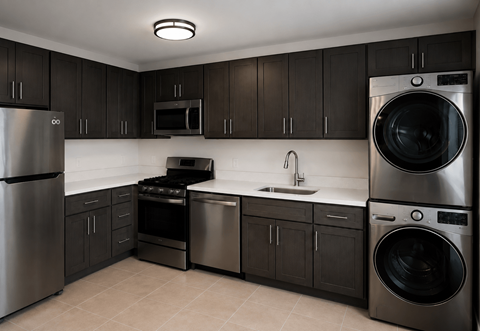 A modern kitchen with dark brown cabinets and stainless steel appliances.