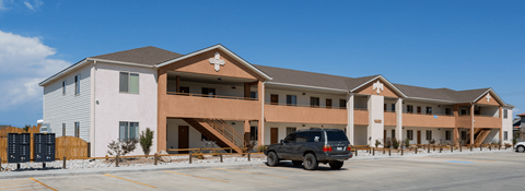 two story building with staircase and balcony to second floor
