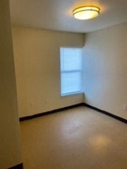 an empty room with a window in it