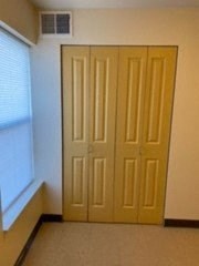 a door in a room next to a window
