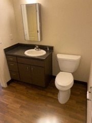 a bathroom with a toilet and a sink