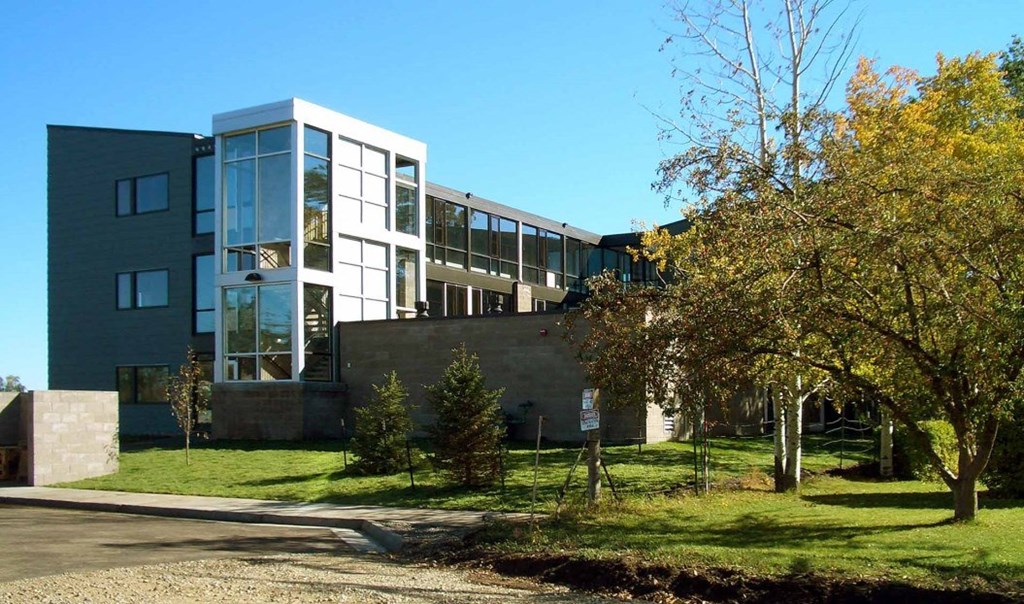 a large building with trees in front of it