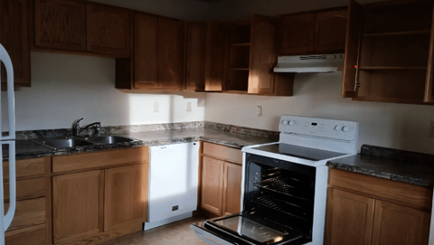 a kitchen with an oven and a sink