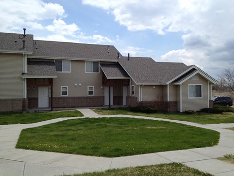 a house with a sidewalk in front of it