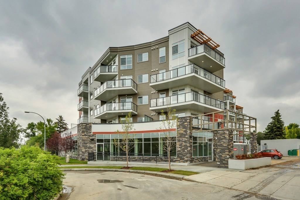 an image of a building with a cloudy sky in the background