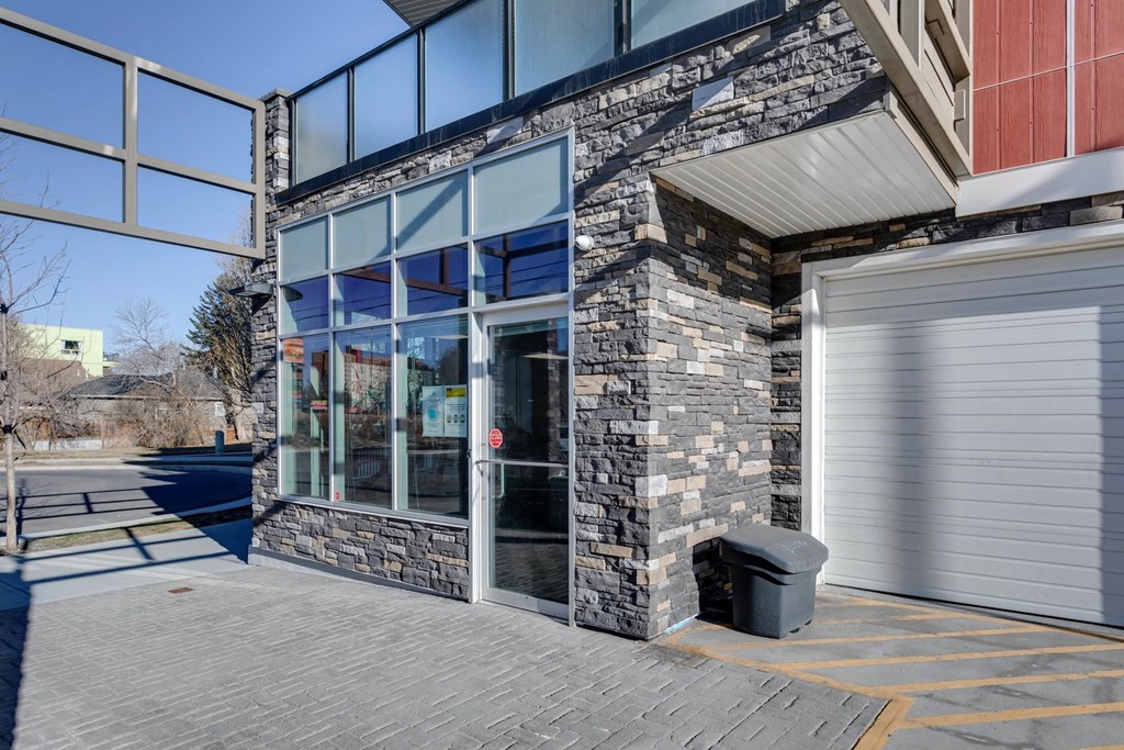 the front of a building with a garage door