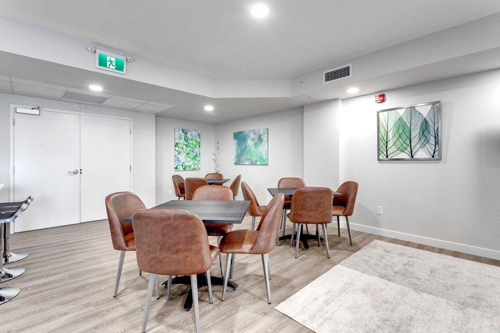 a dining room with a table and chairs