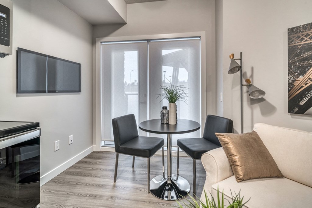 a living room with a couch and a table and a tv
