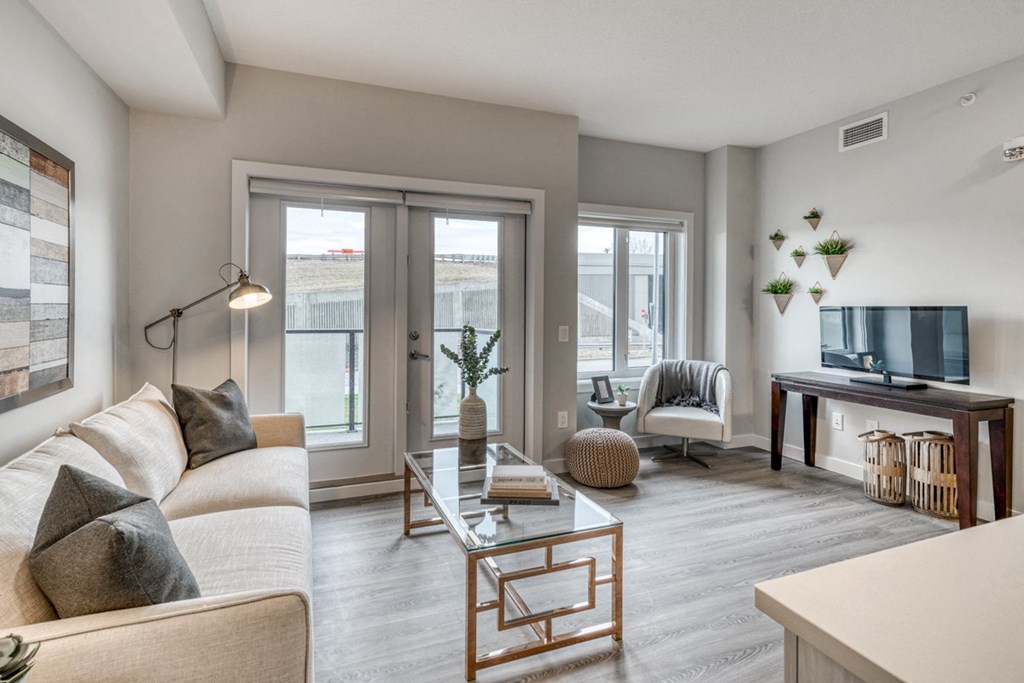 2 bedroom apartment living room with a couch and a glass coffee table