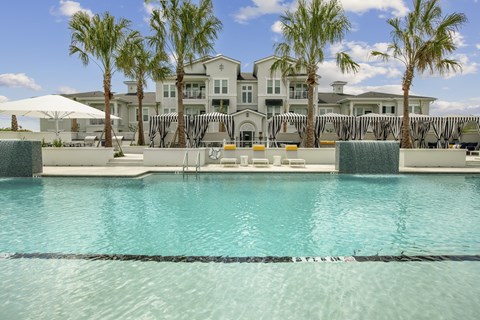 Resort style pool with fountain and seating