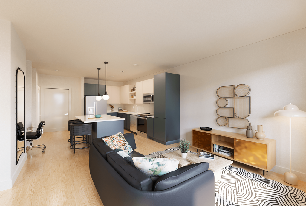 a living room with a couch and a chair and a kitchen