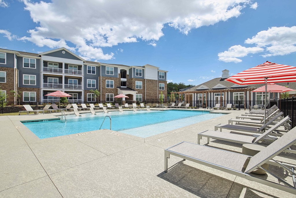 our apartments offer a swimming pool with lounge chairs and umbrellas