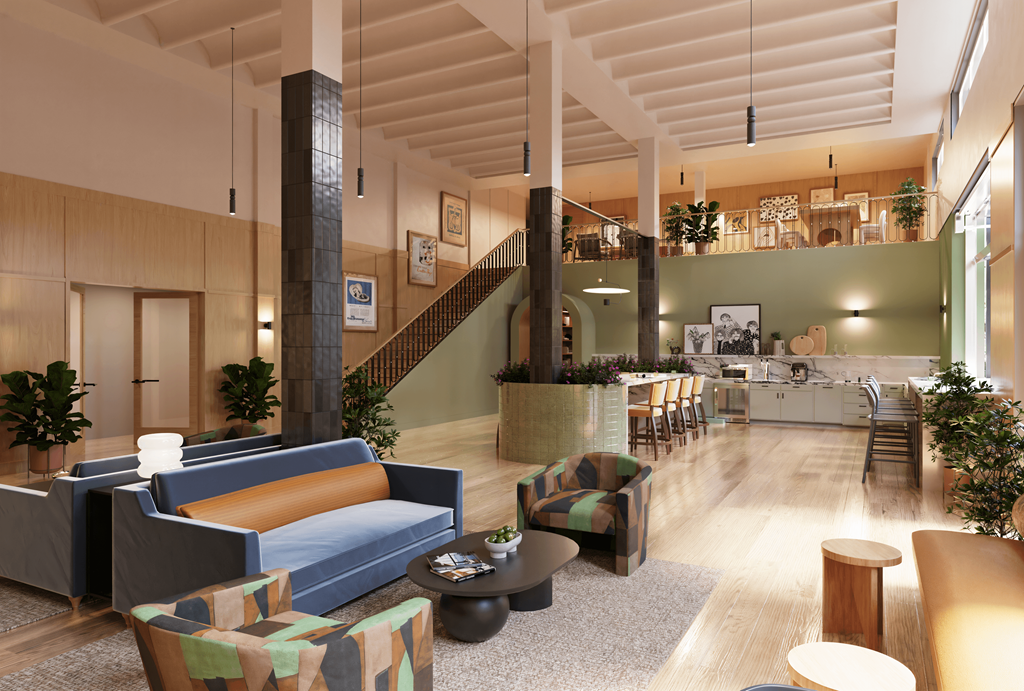 a lobby with couches and chairs and a kitchen with a staircase