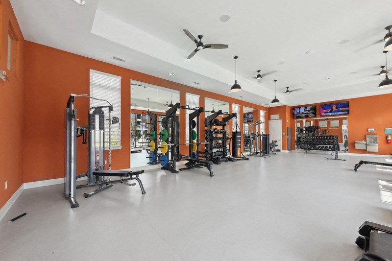 a fitness center with treadmills and other exercise equipment