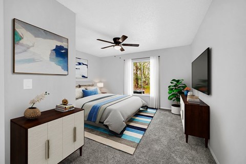 a bedroom with a bed and a ceiling fan at Southern Oaks Residences