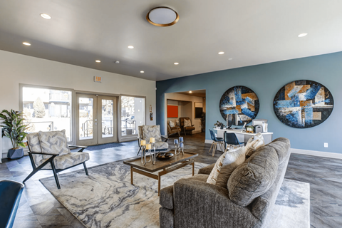 A living room with a grey couch and a coffee table.