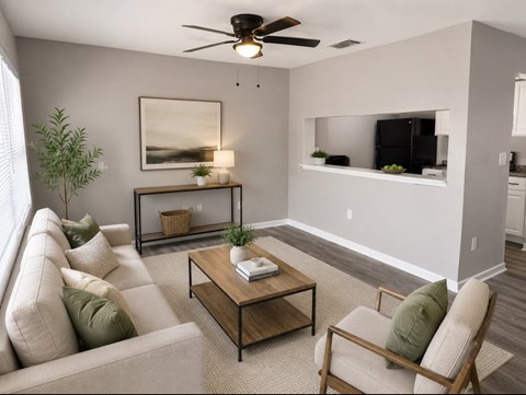 A living room with a couch, chair, and a coffee table.