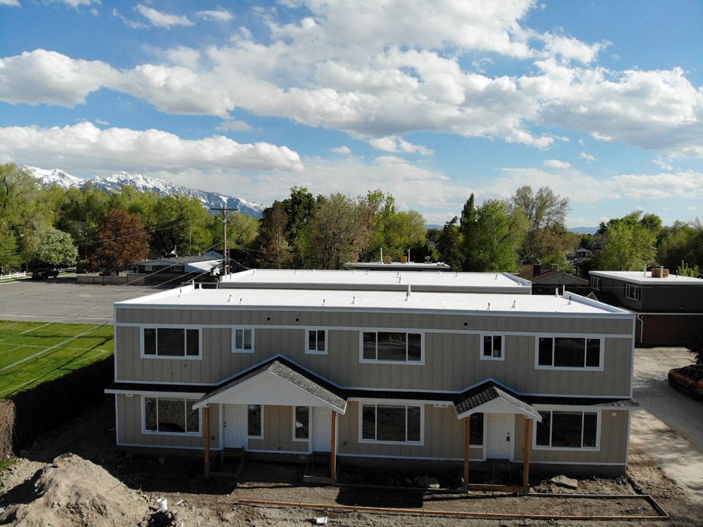 an aerial view of a house with a metal roof