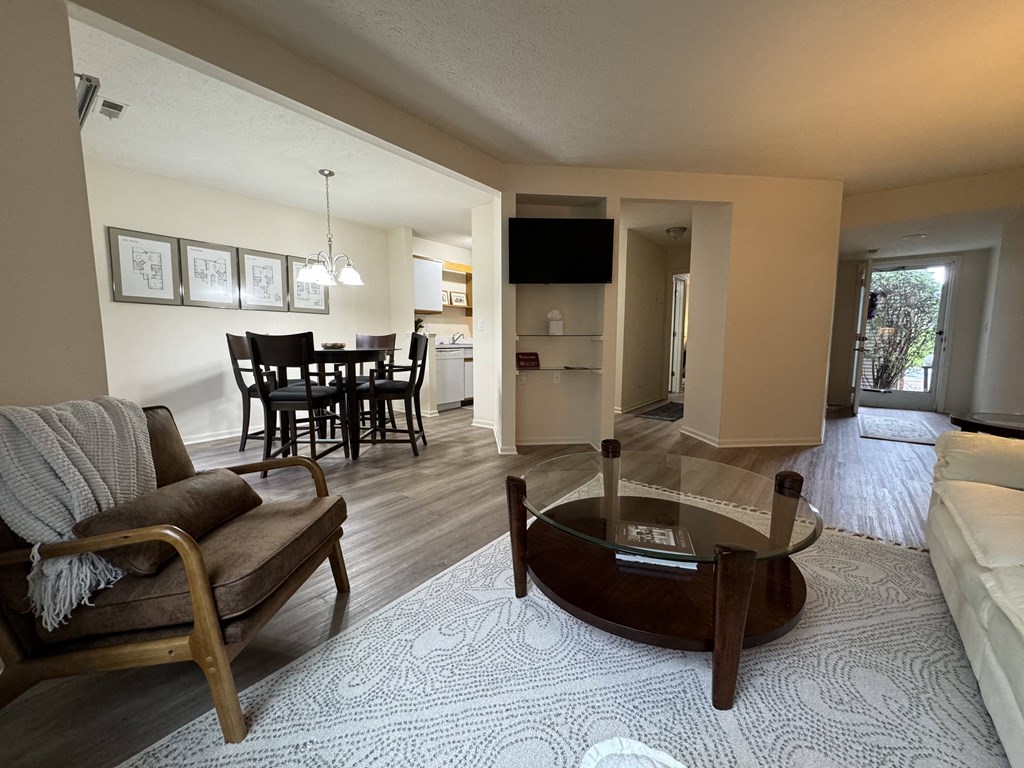 a view of a living room and dining room with a couch and a table