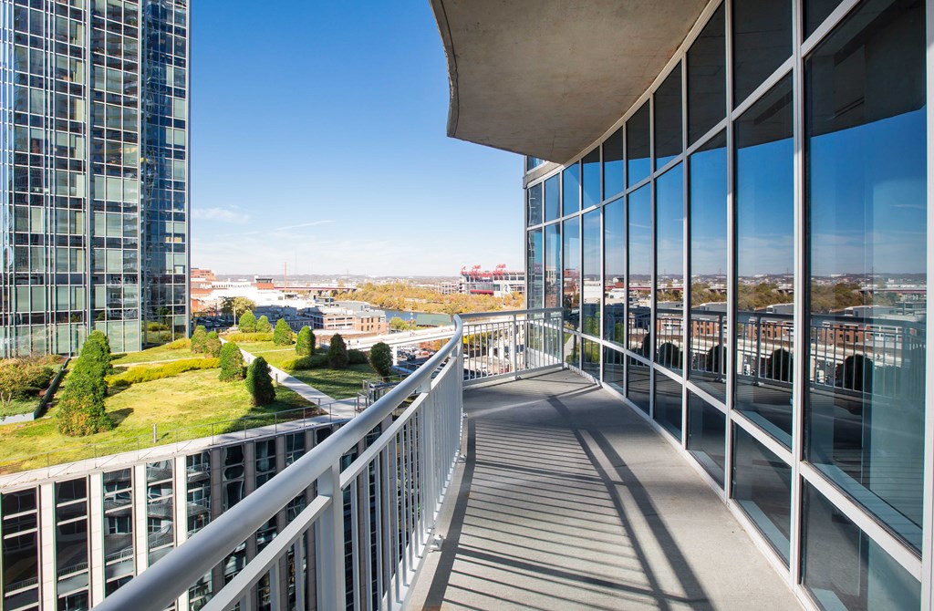 a view of the city from a balcony of a building