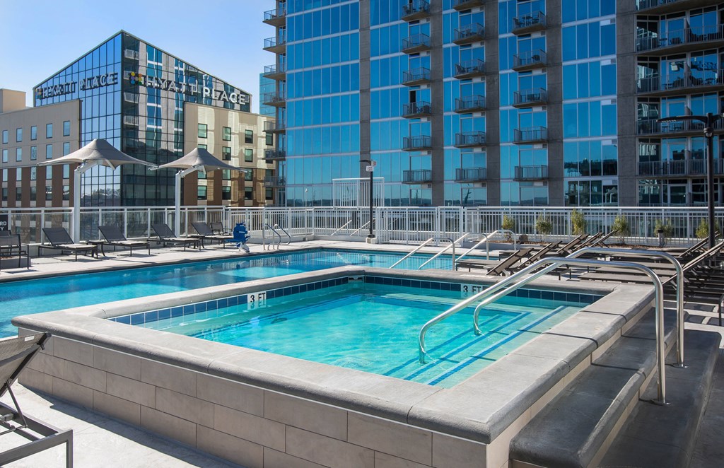 a swimming pool with a building in the background