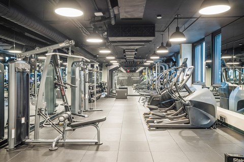 Modern fitness center with strength, cardio, and stretching options at Coda on Half Apartments, Washington District of Columbia