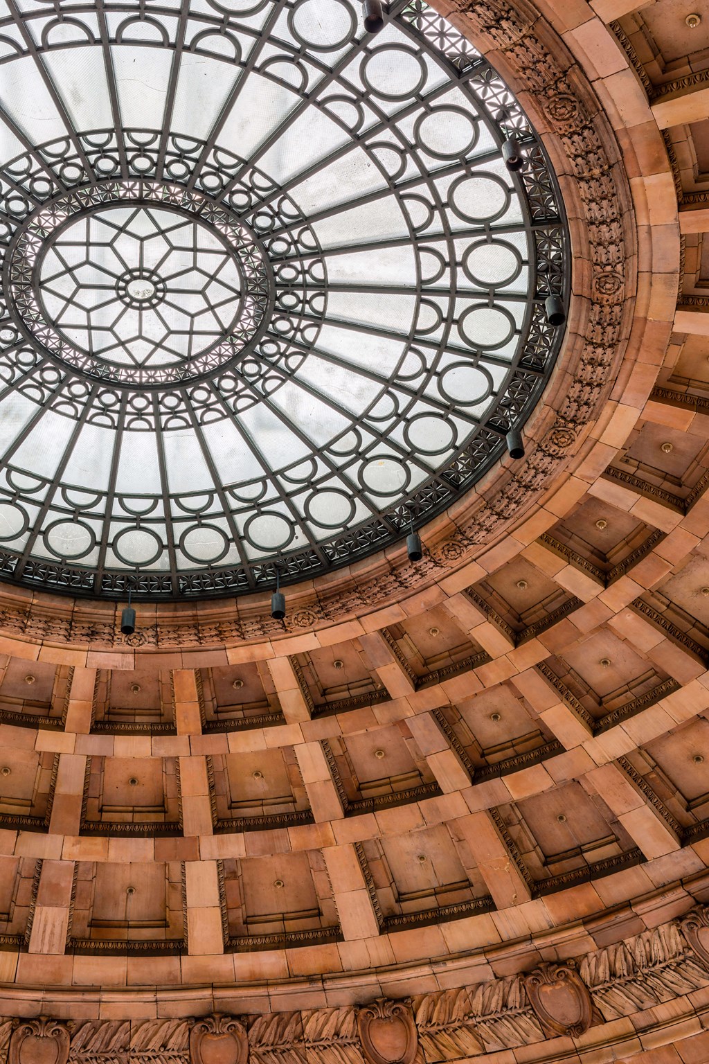 A large, ornate glass dome in the center of a building at The Pennsylvanian Apartments, Pennsylvania