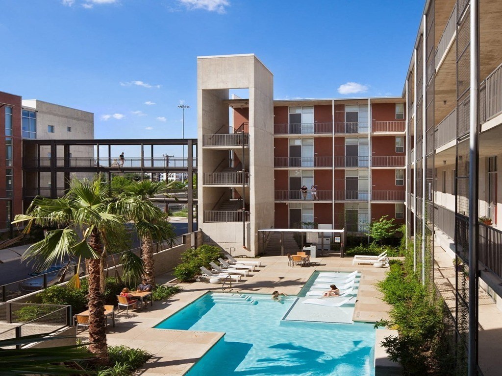 View of a Pool Side Relaxing Area With Sundeck at 1221 Broadway Lofts, San Antonio