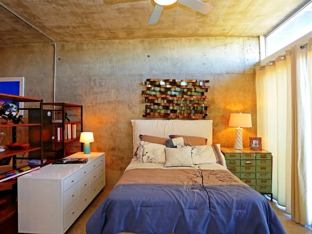 Cozy Bedroom with bookshelf at 1221 Broadway Lofts, San Antonio, 78215