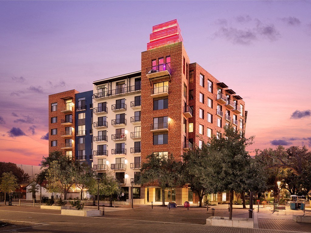 a rendering of a building with a red roof on top of it