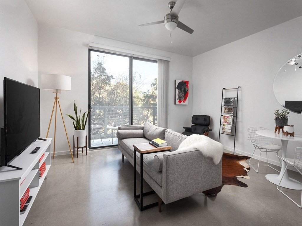 a living room with a couch and a tv