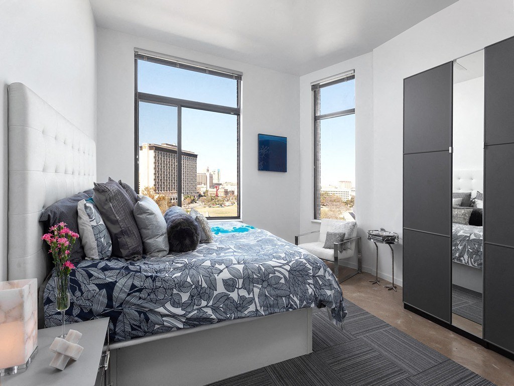 a large room with a bed in the middle of it