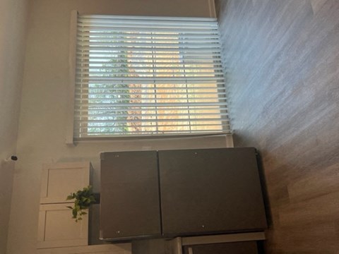 a room with a television and a window