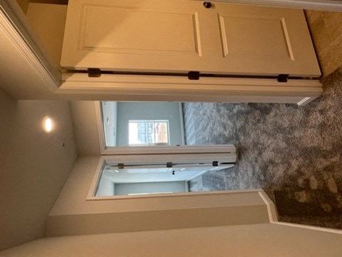 a bathroom with a window and a sink