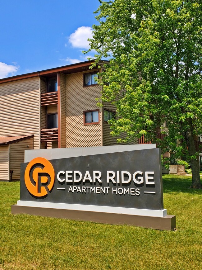 a sign for cedar ridge apartment homes
