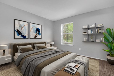 A bedroom with a large bed and two framed pictures on the wall.