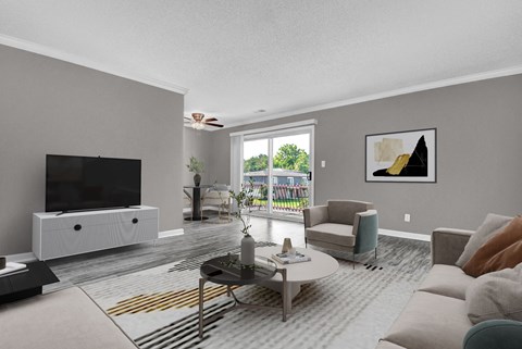 A living room with a television, a white cabinet, a grey sofa, a coffee table, and a painting on the wall.