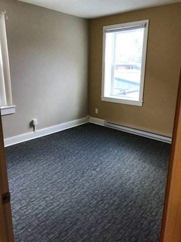 an empty room with a window and