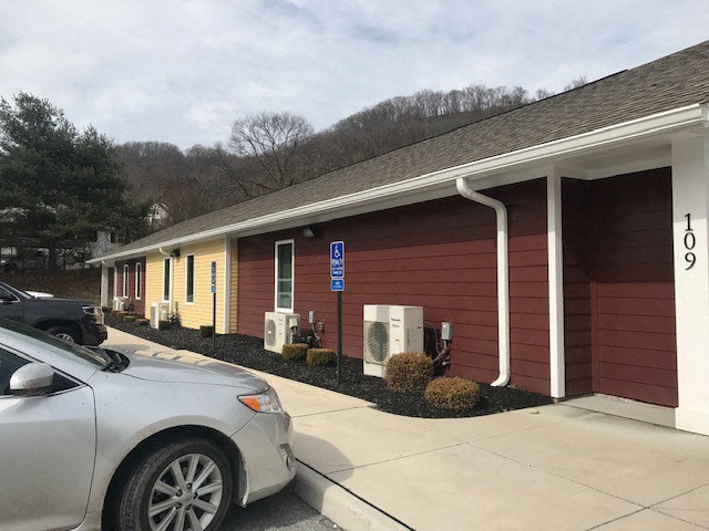 a building with a car parked outside of it