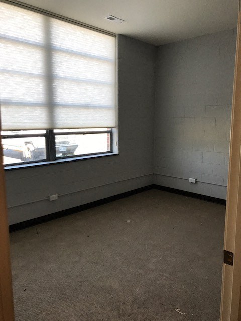an empty room with a large window in it