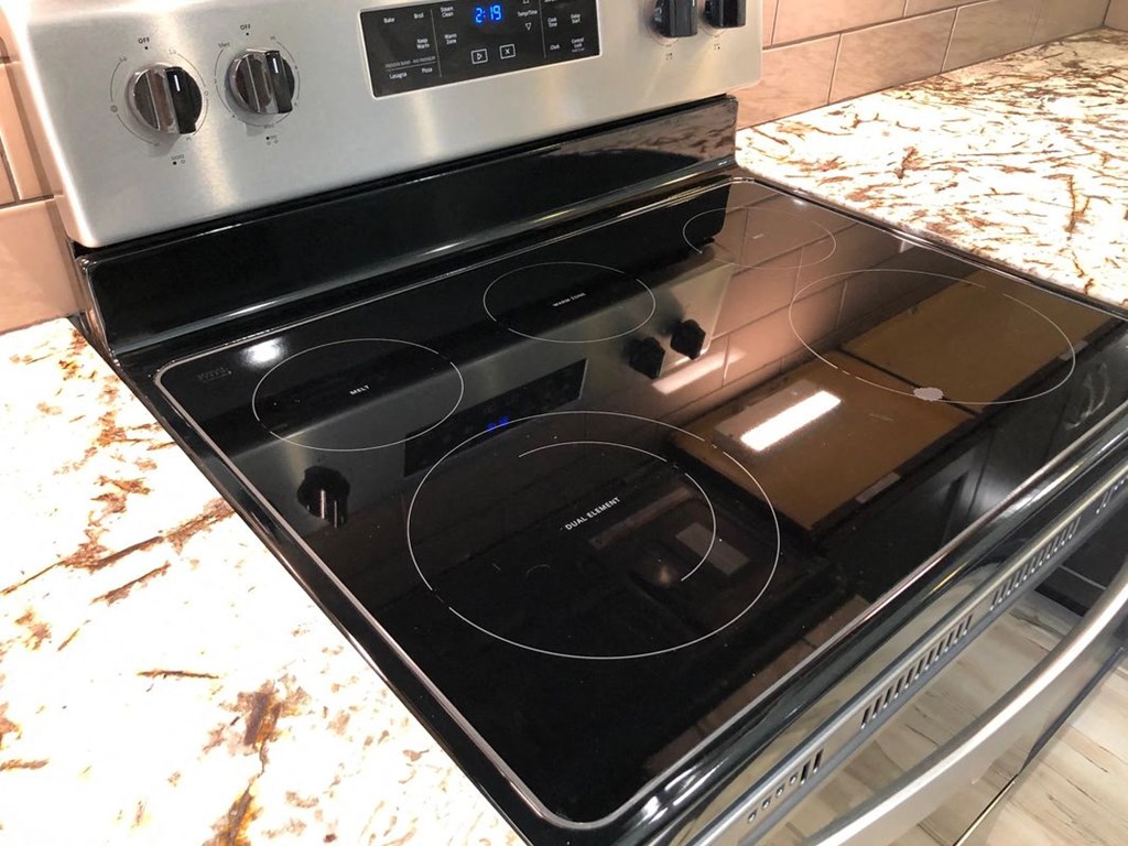 a stove top oven sitting on top of a kitchen counter